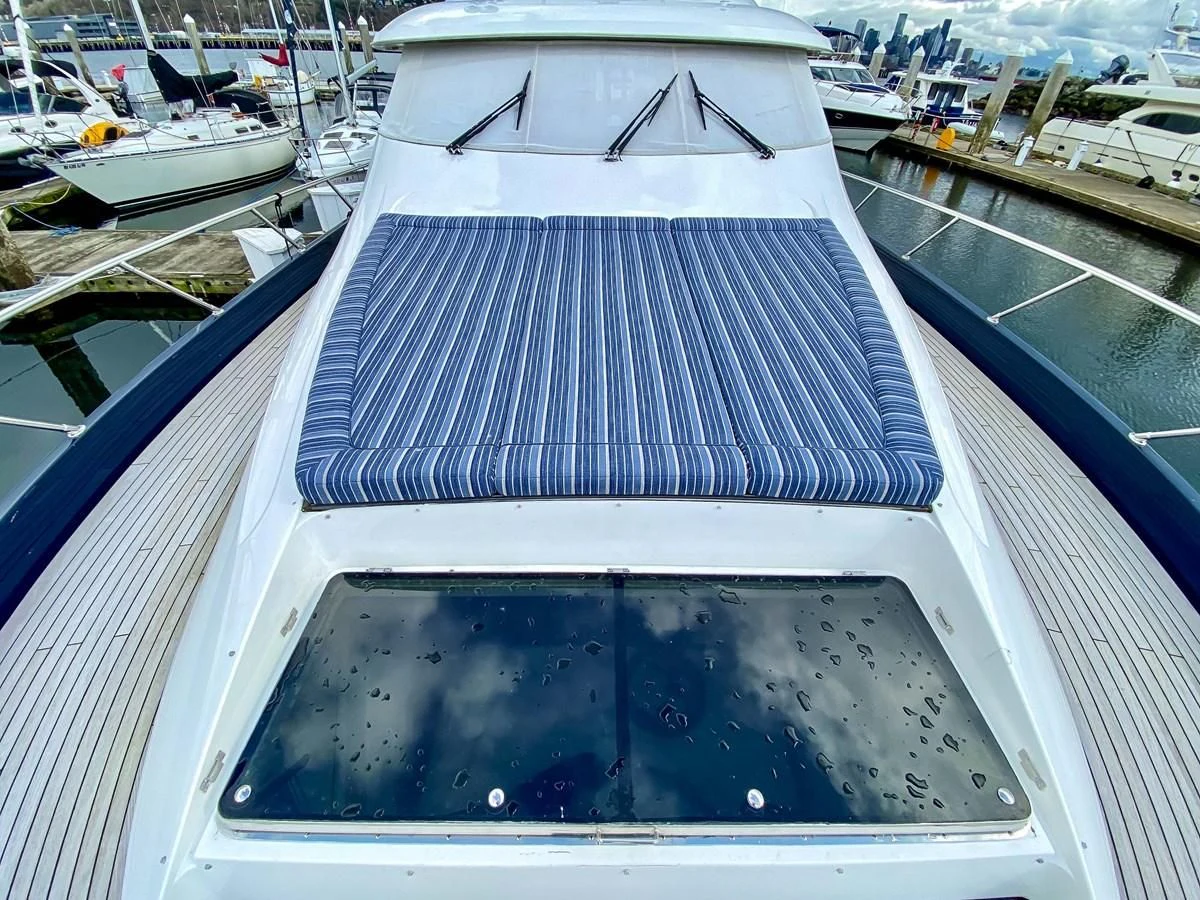 a boat with a large deck aboard UNDAUNTED Yacht for Sale
