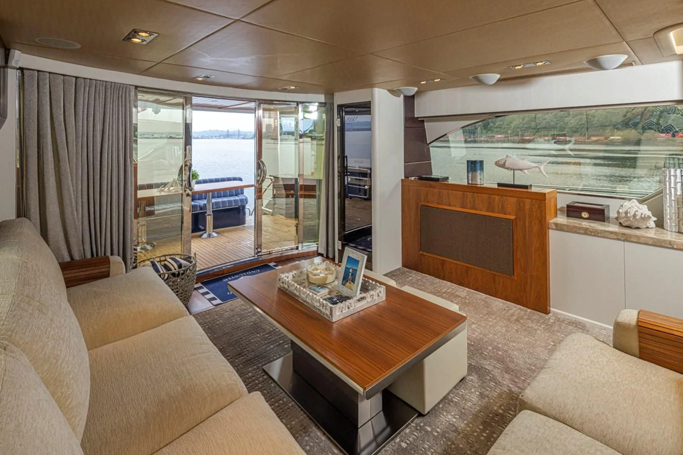 a living room with a large glass door aboard UNDAUNTED Yacht for Sale