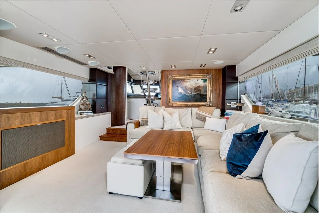 a living room with a large fireplace aboard UNDAUNTED Yacht for Sale