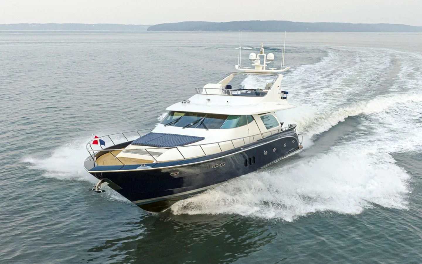 a boat on the water aboard UNDAUNTED Yacht for Sale