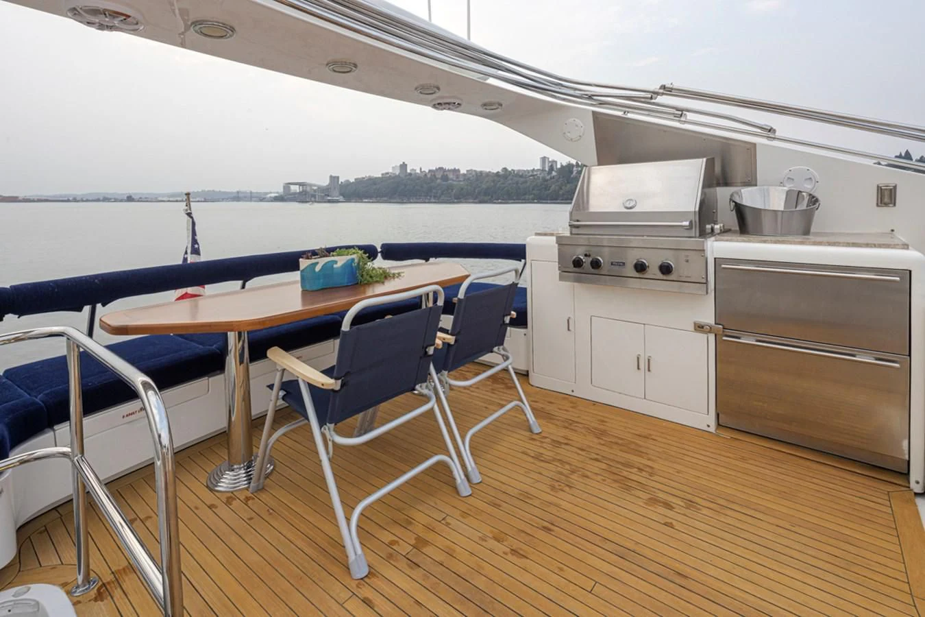 a kitchen with a table and chairs aboard UNDAUNTED Yacht for Sale