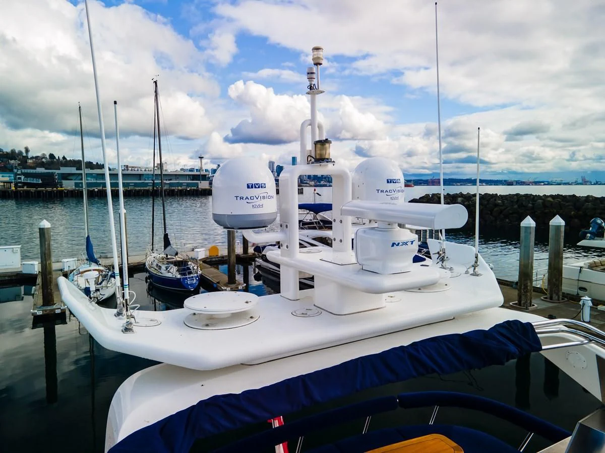 a boat docked at a pier aboard UNDAUNTED Yacht for Sale