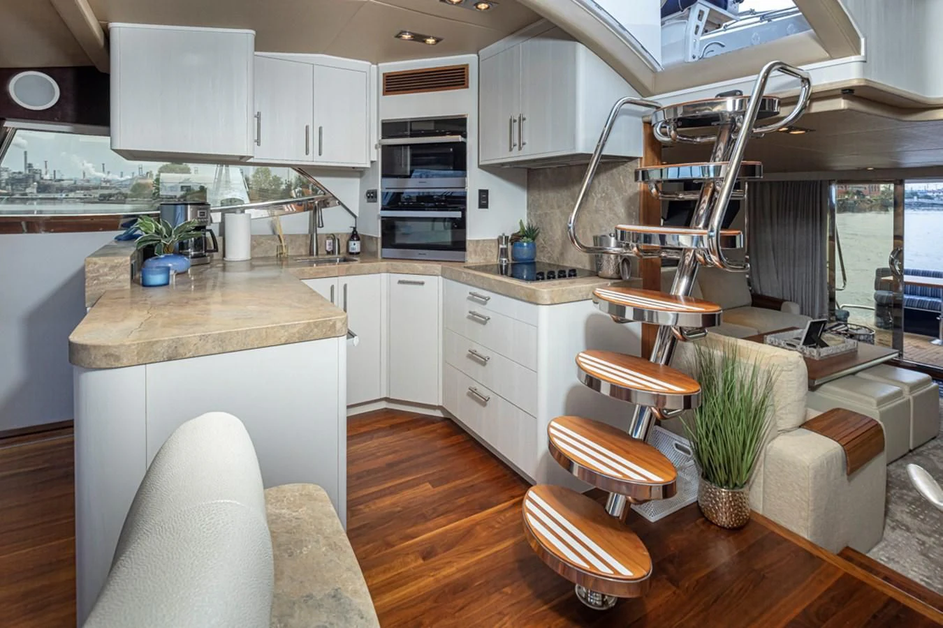 a kitchen with white cabinets aboard UNDAUNTED Yacht for Sale