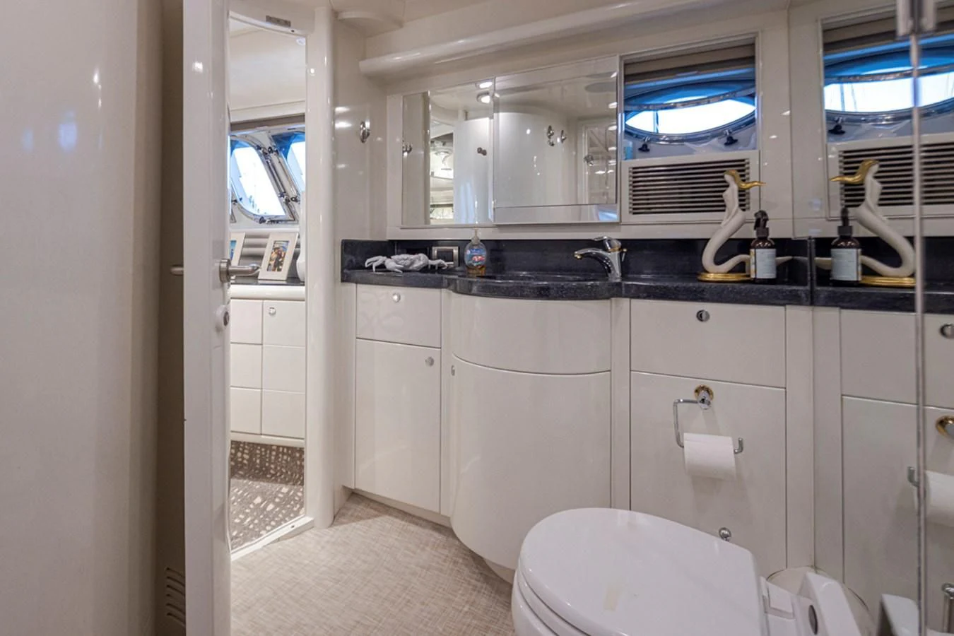 a bathroom with a sink and a toilet aboard UNDAUNTED Yacht for Sale