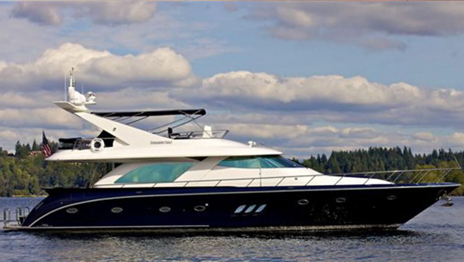 a boat on the water aboard UNDAUNTED Yacht for Sale