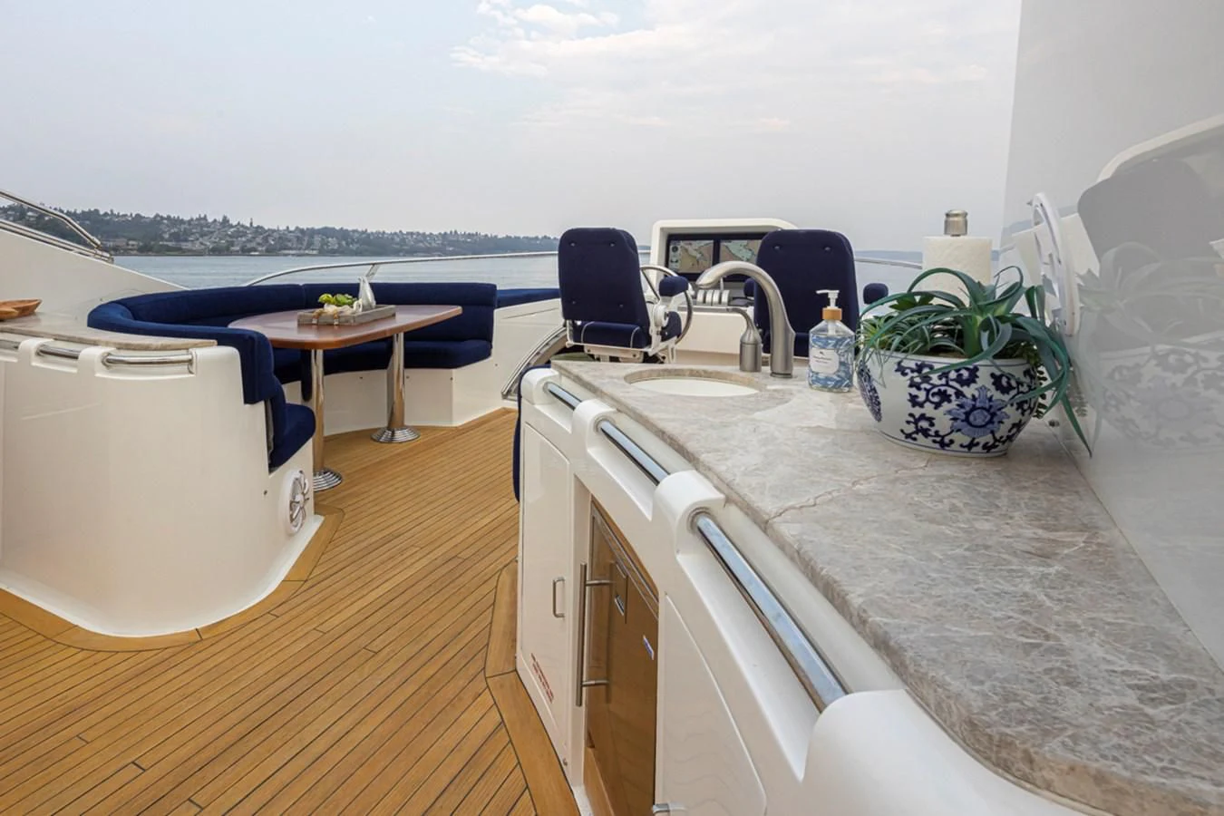 a kitchen with a table and chairs aboard UNDAUNTED Yacht for Sale