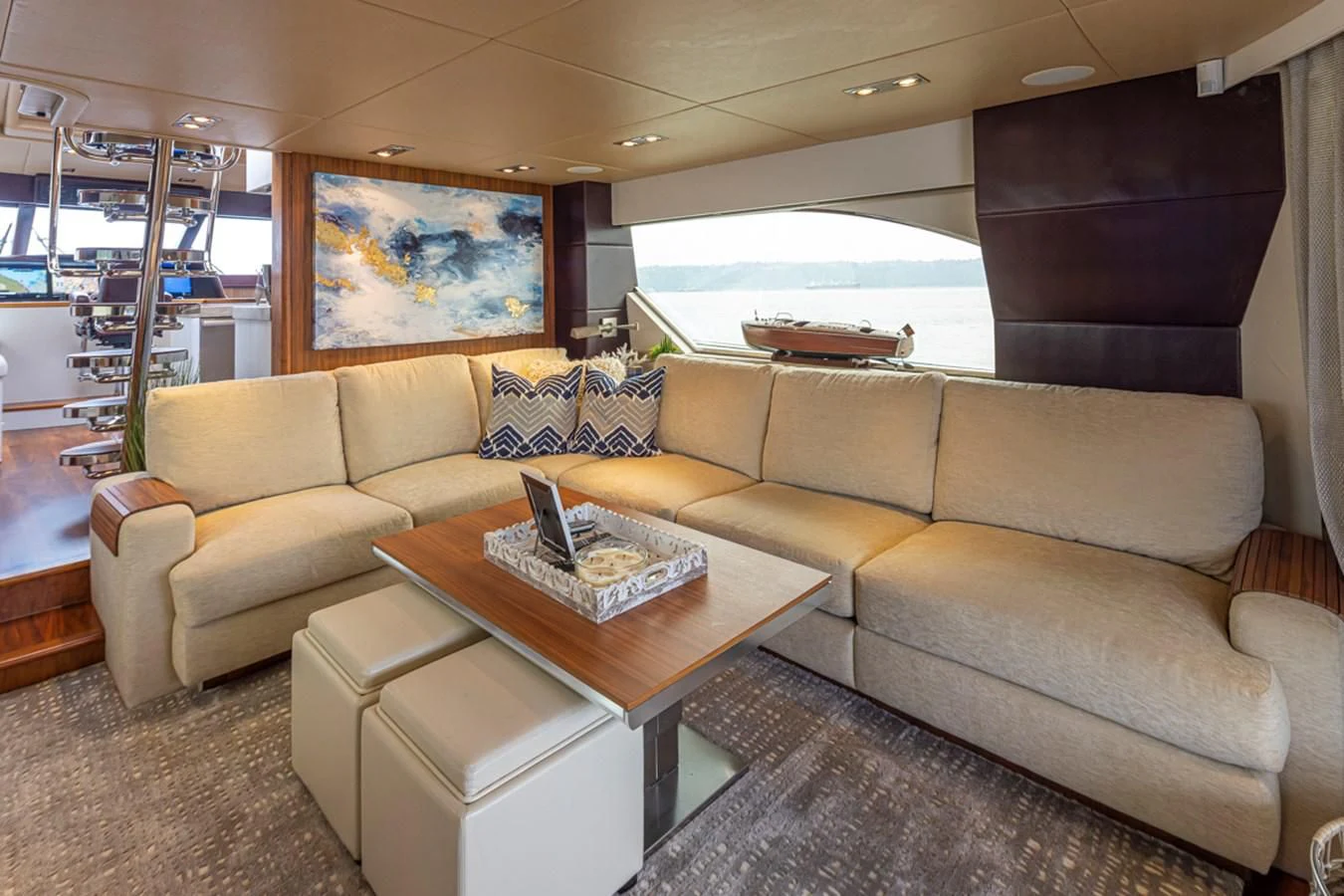 a living room with a couch and a coffee table aboard UNDAUNTED Yacht for Sale