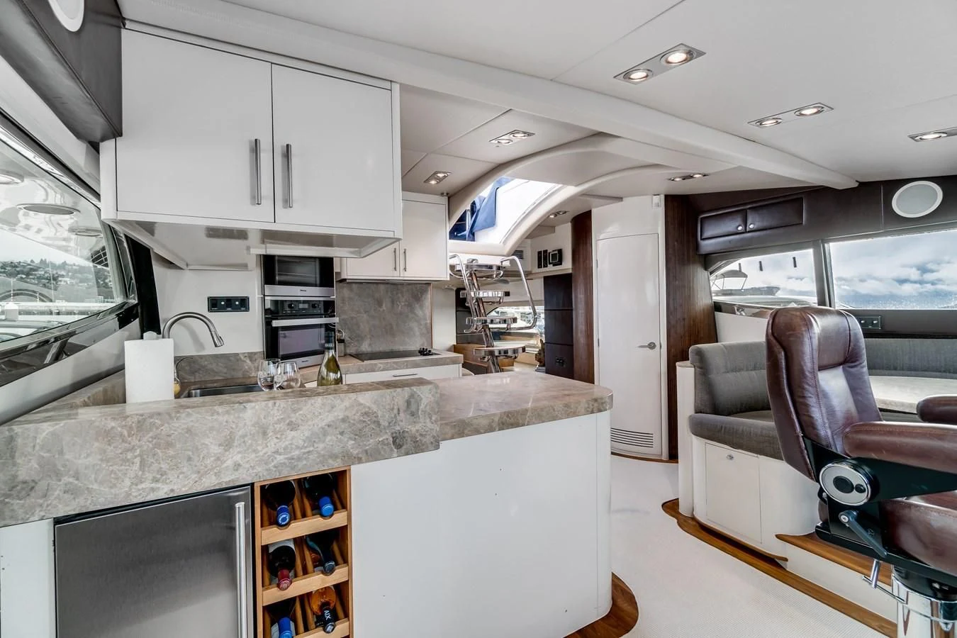 a kitchen with a sink and cabinets aboard UNDAUNTED Yacht for Sale