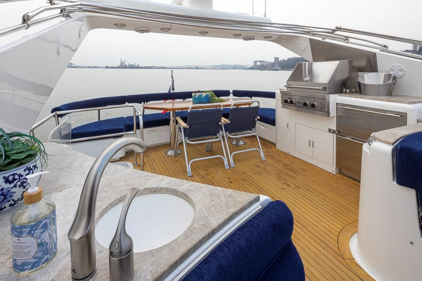 a large white tent with a table and chairs aboard UNDAUNTED Yacht for Sale