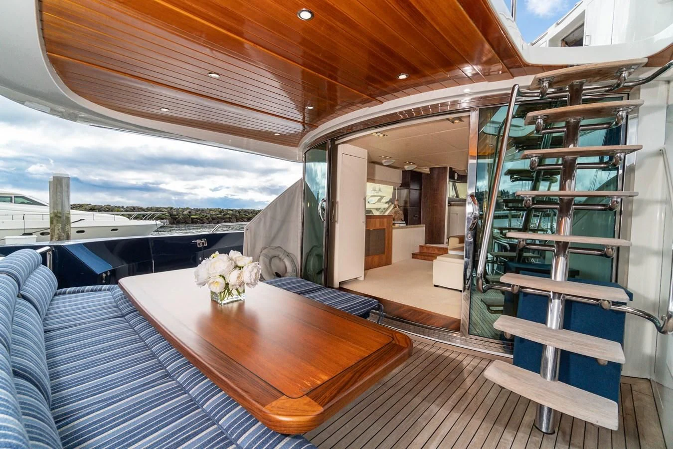 a room with a table and chairs aboard UNDAUNTED Yacht for Sale