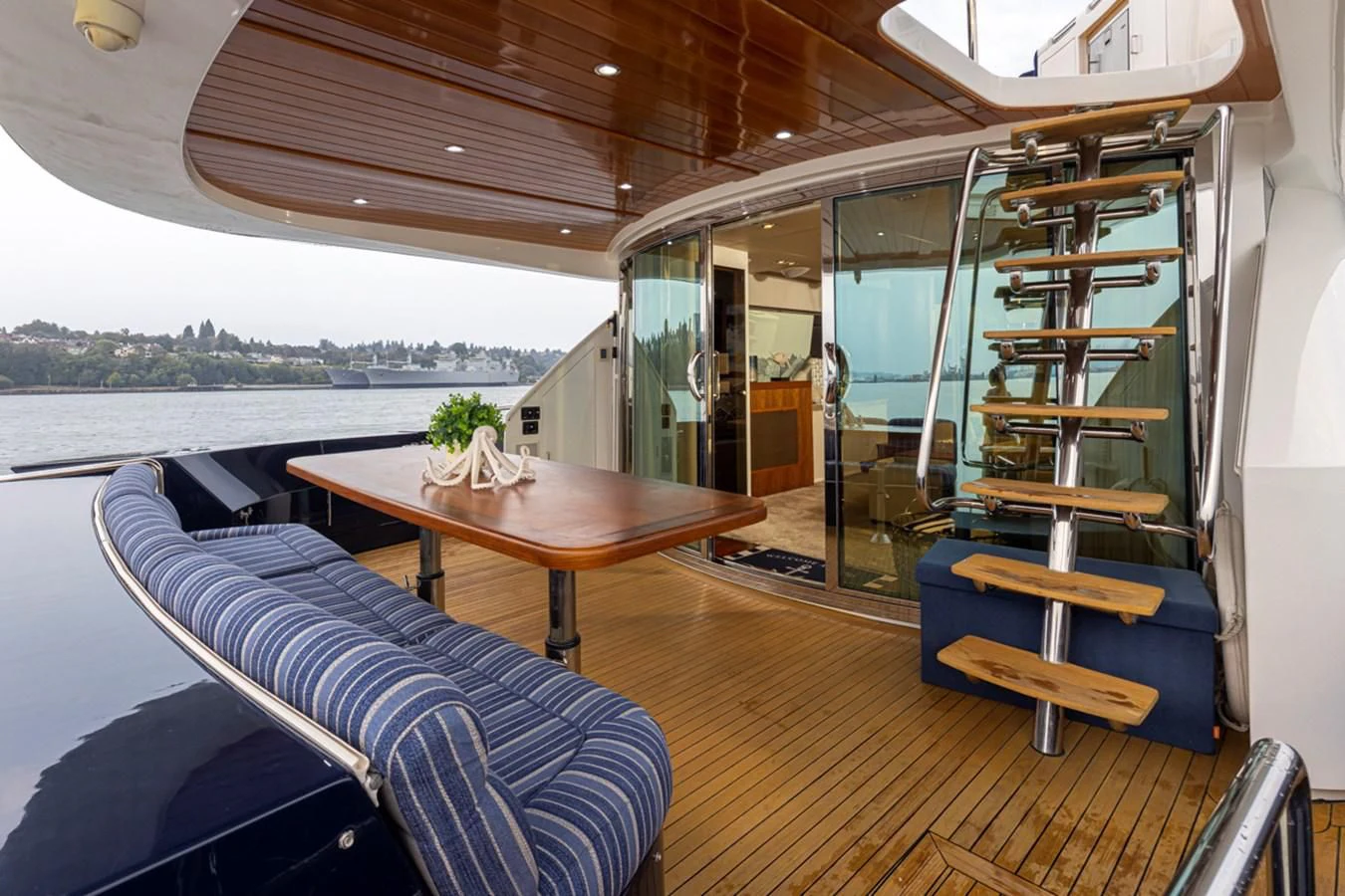 a room with a table and chairs aboard UNDAUNTED Yacht for Sale