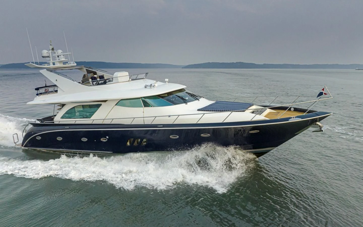 a boat on the water aboard UNDAUNTED Yacht for Sale