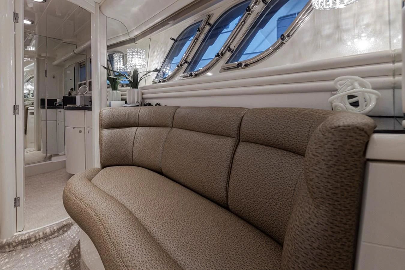 a couch in a room aboard UNDAUNTED Yacht for Sale
