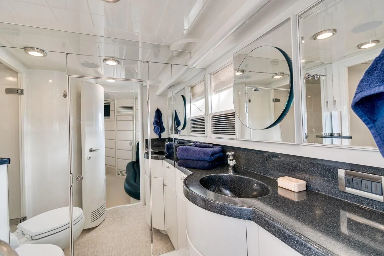 a bathroom with a sink and a mirror aboard UNDAUNTED Yacht for Sale