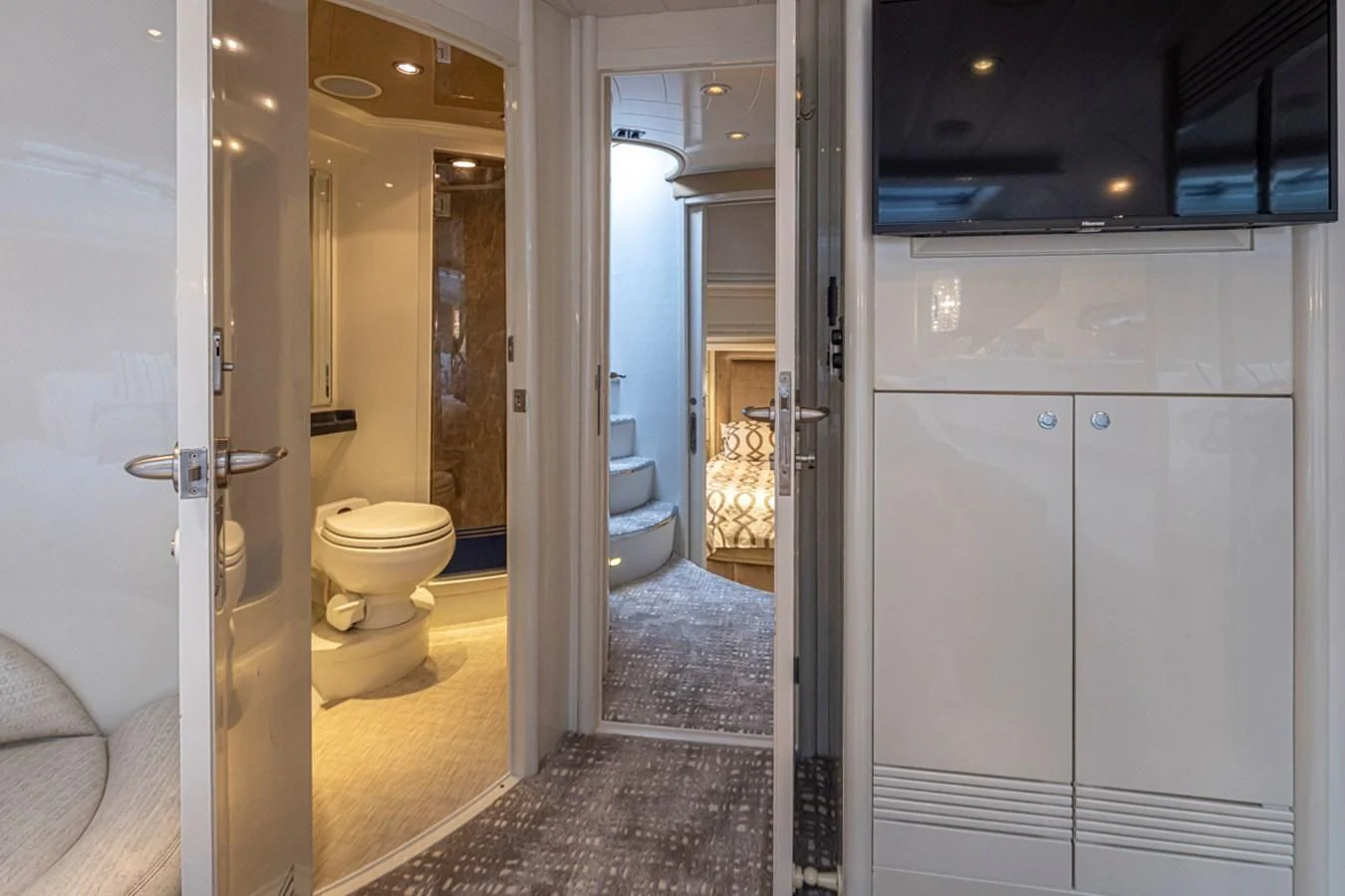 a bathroom with a glass door aboard UNDAUNTED Yacht for Sale