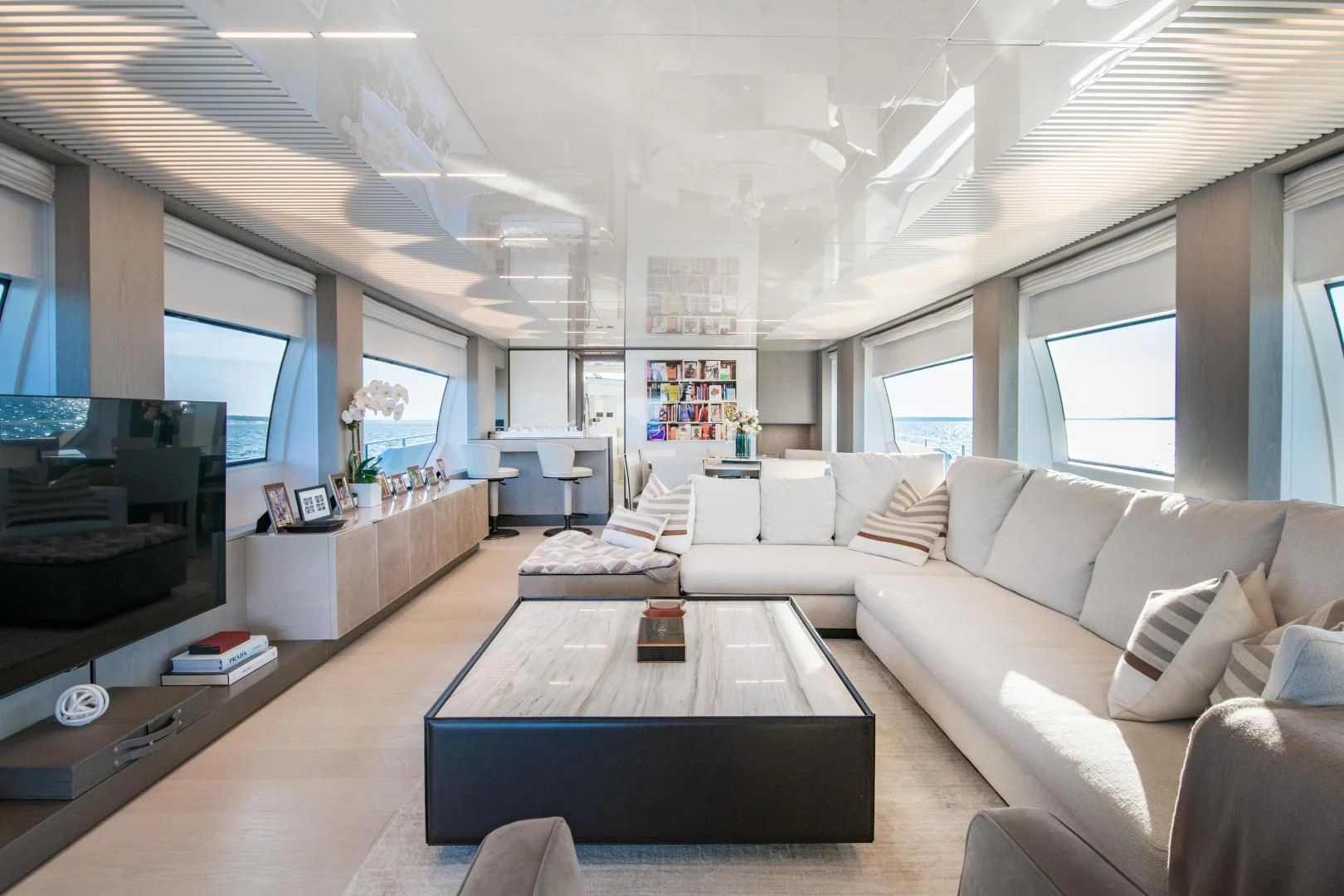 a living room with a large window aboard ISLA MARIE Yacht for Sale