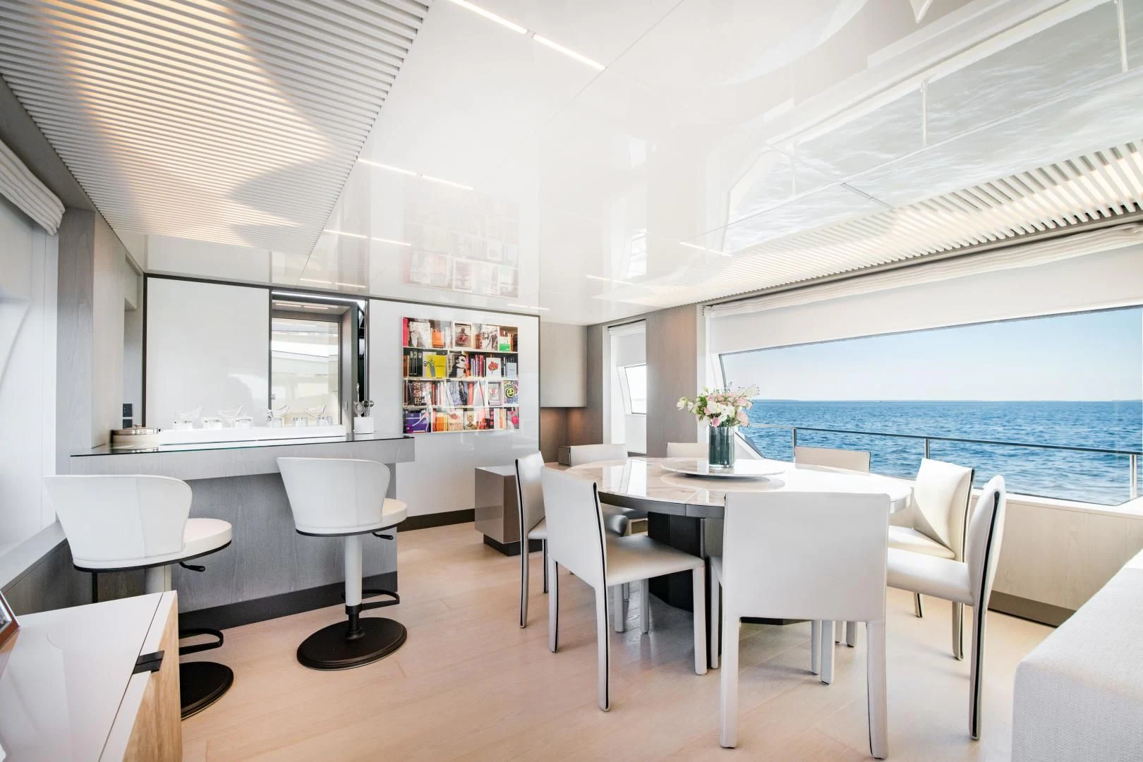 a room with tables and chairs aboard ISLA MARIE Yacht for Sale