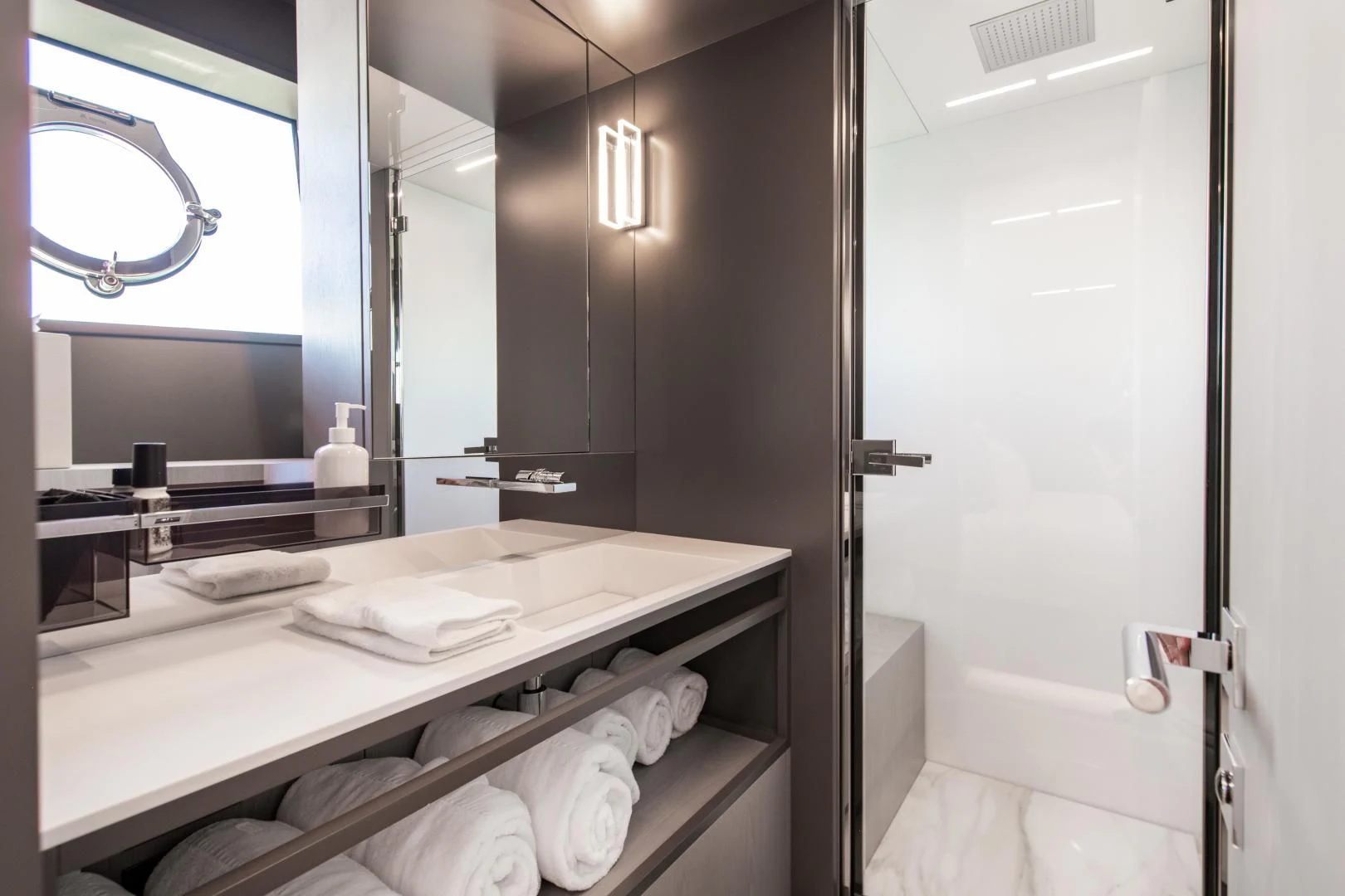 a bathroom with a large mirror aboard ISLA MARIE Yacht for Sale