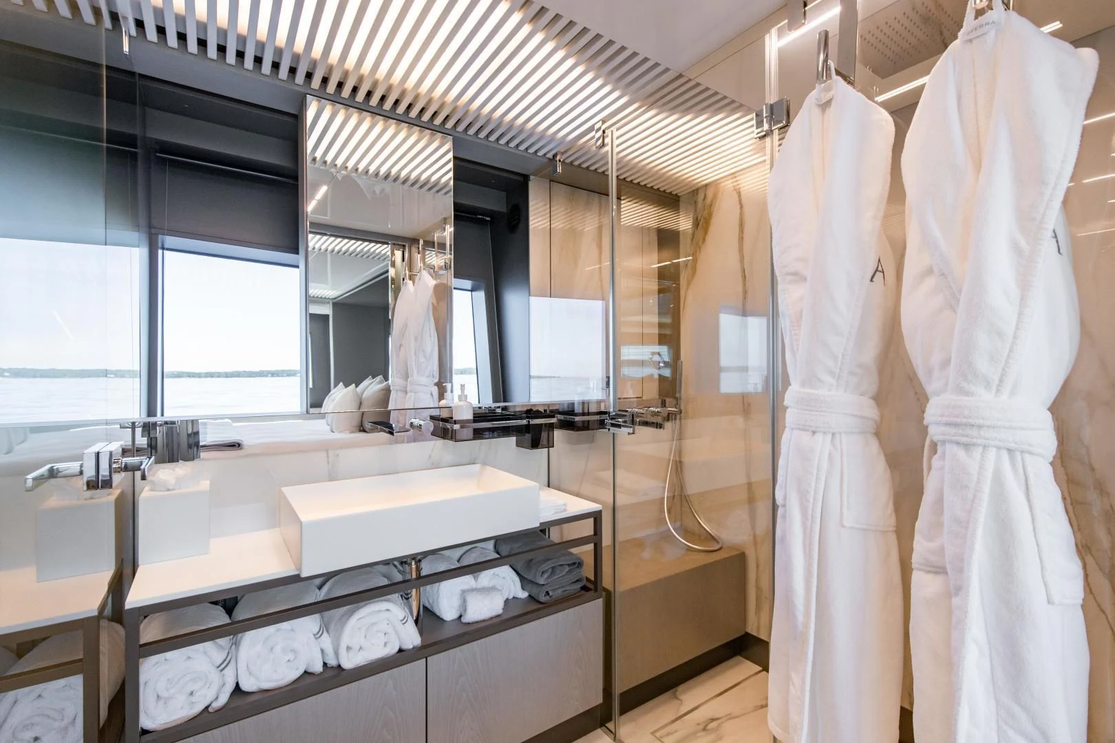a bathroom with a large white towel on the wall aboard ISLA MARIE Yacht for Sale