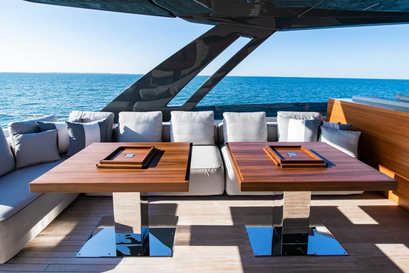 a lounge area with a large body of water in the background aboard ISLA MARIE Yacht for Sale