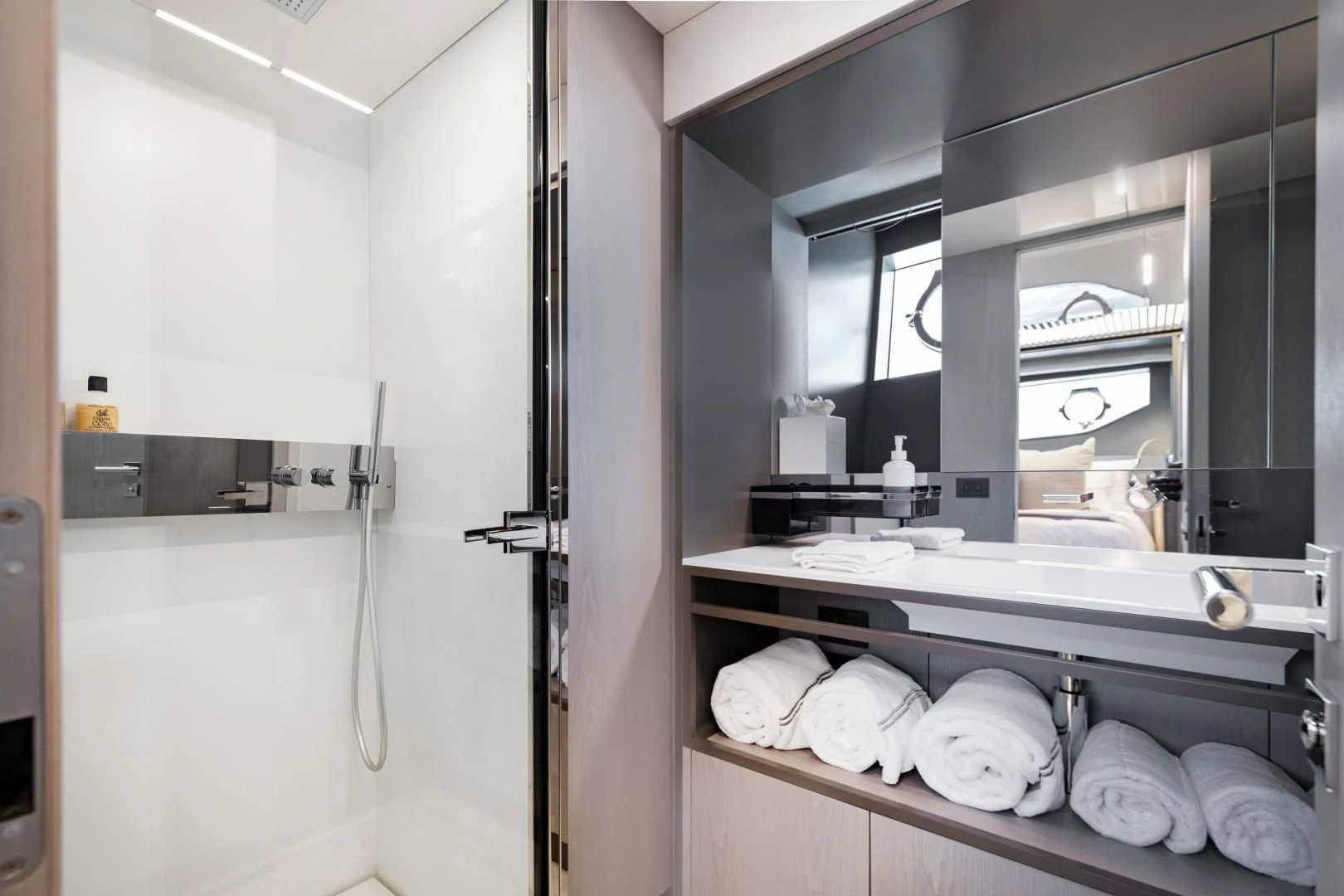 a bathroom with a large mirror aboard ISLA MARIE Yacht for Sale