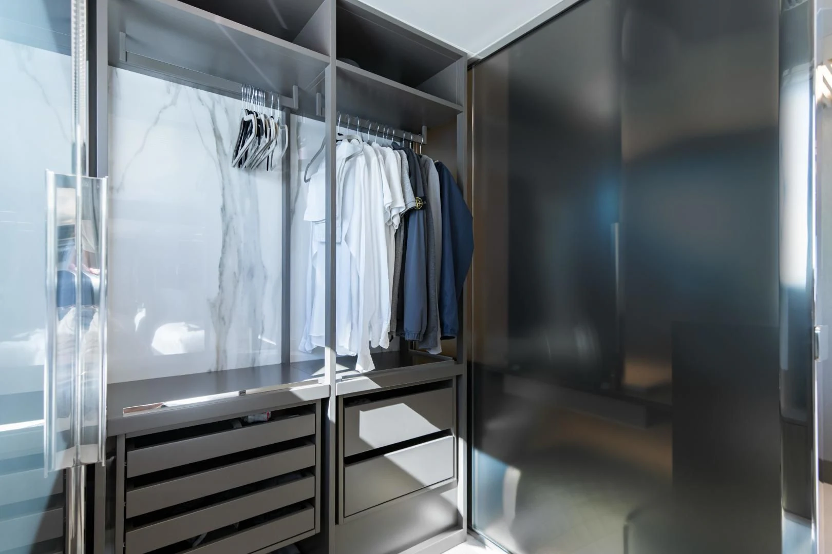 a closet with clothes on it aboard ISLA MARIE Yacht for Sale