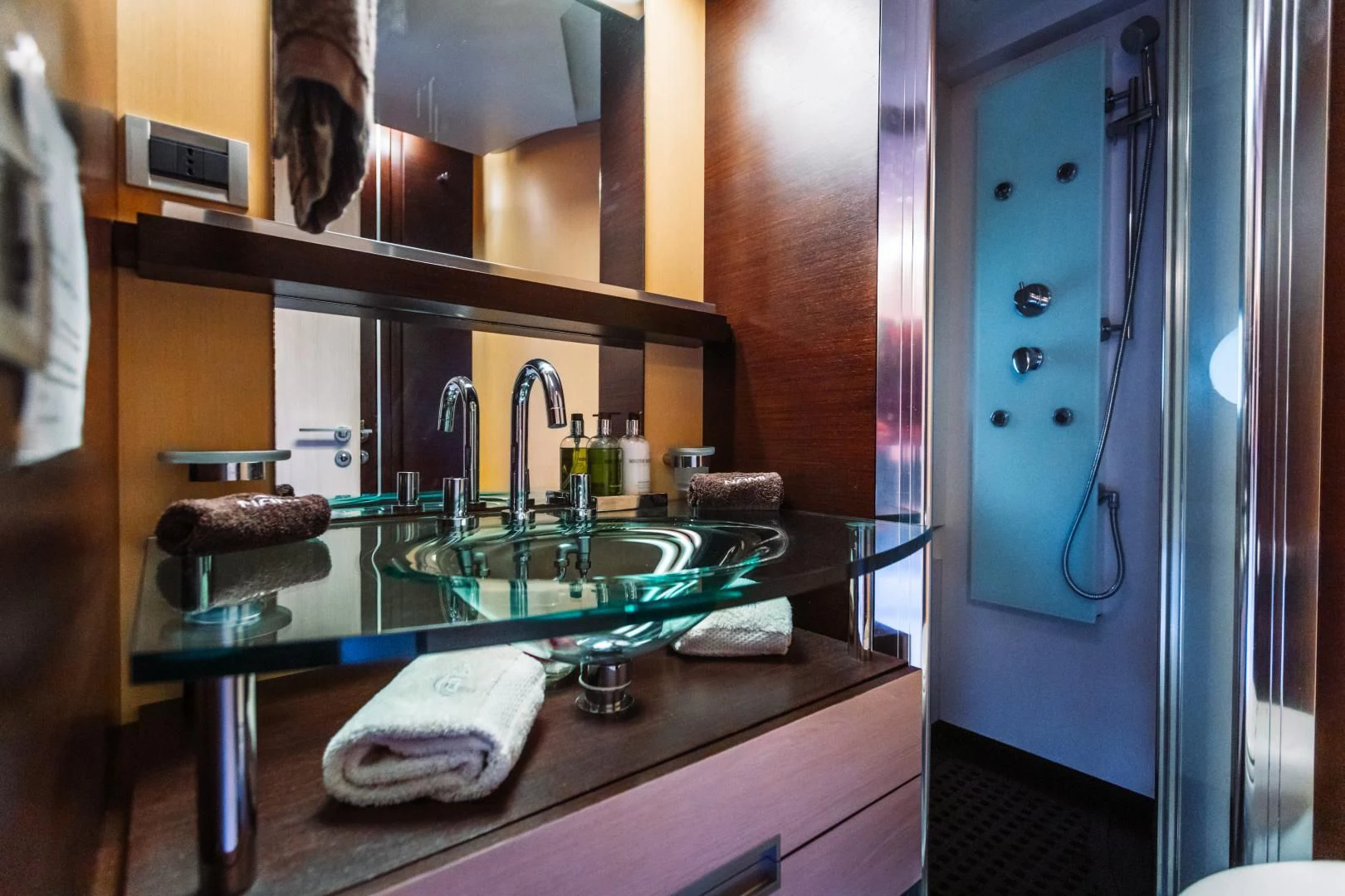 a bathroom with a sink and a mirror aboard NAMI Yacht for Sale