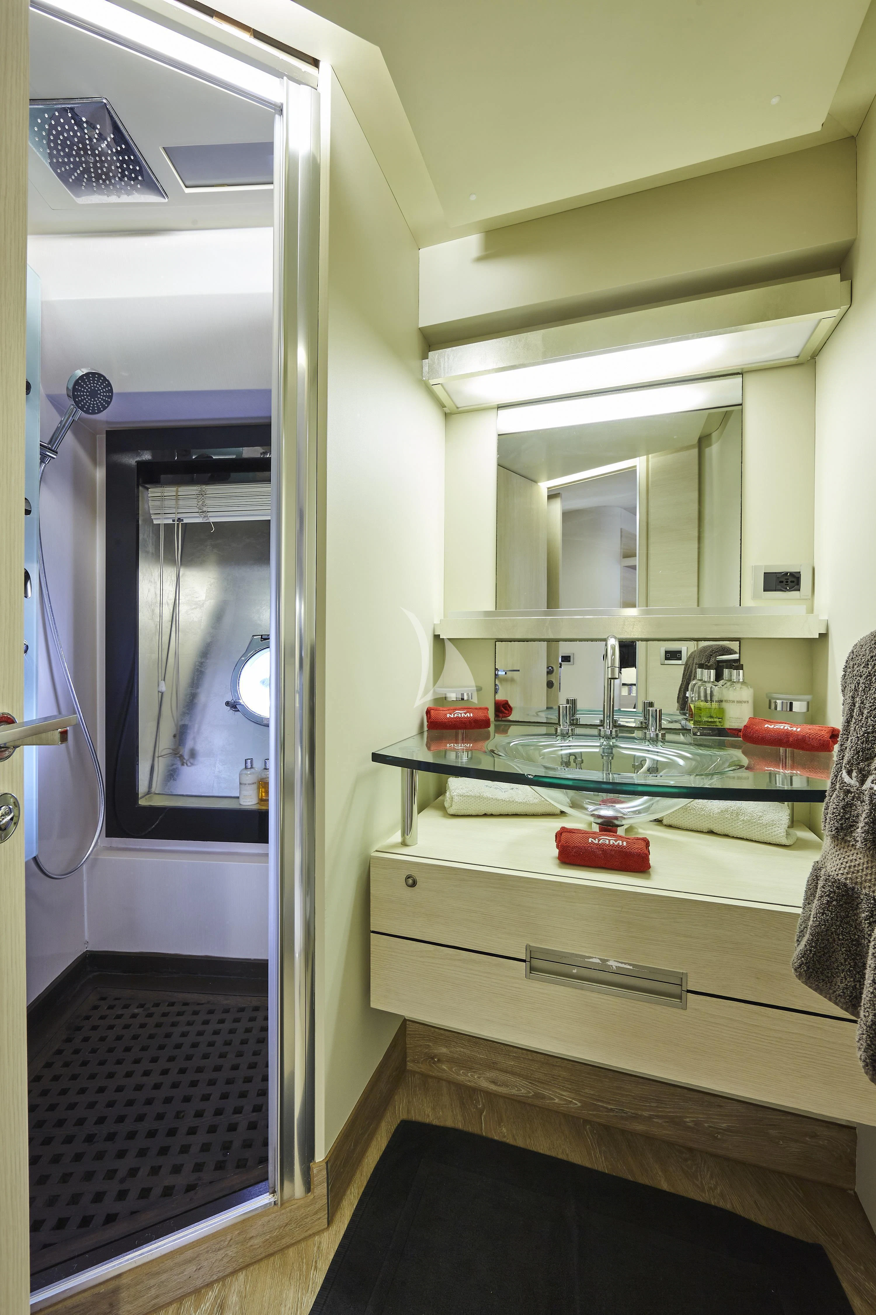 a bathroom with a sink and a mirror aboard NAMI Yacht for Sale