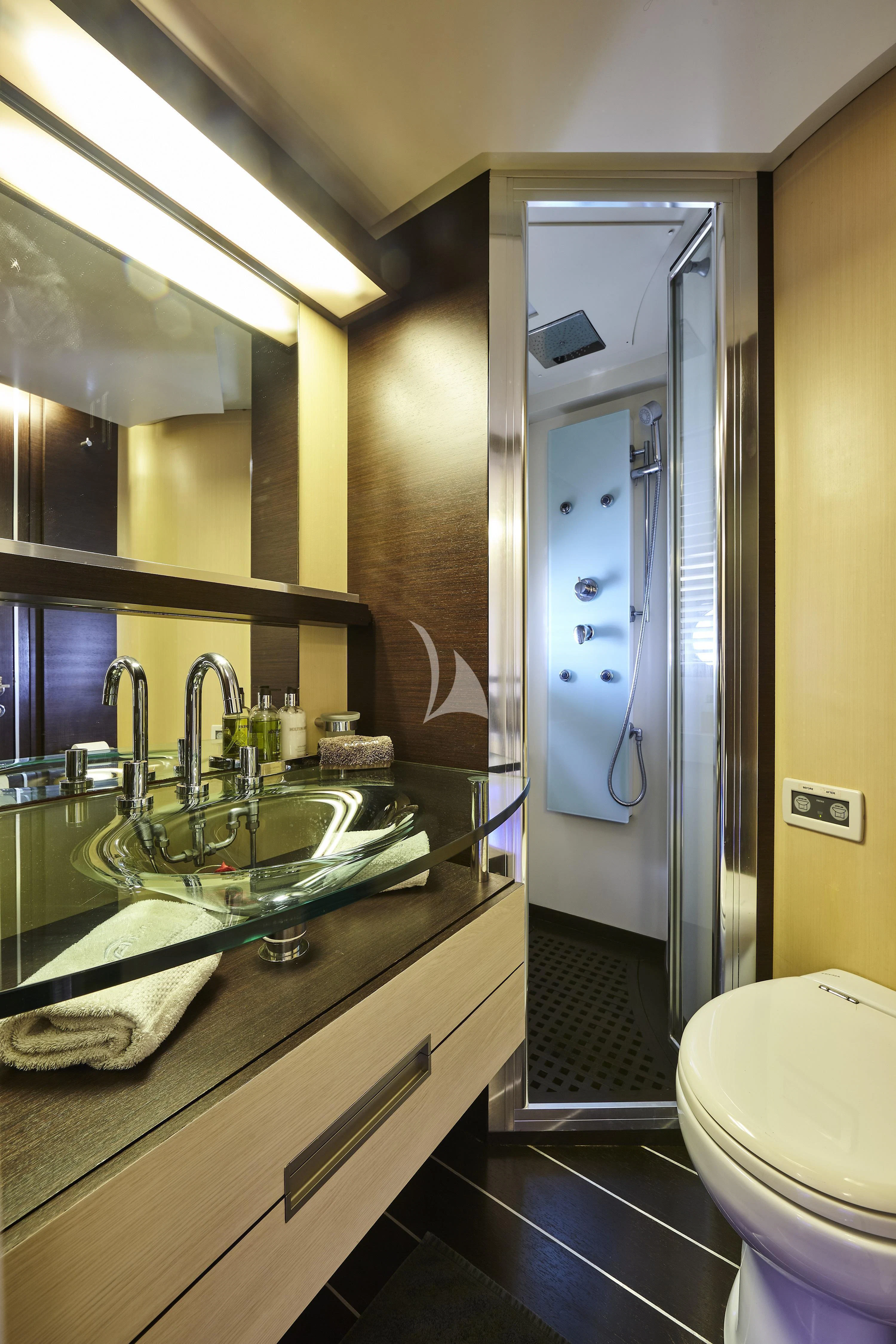 a bathroom with a glass shower aboard NAMI Yacht for Sale