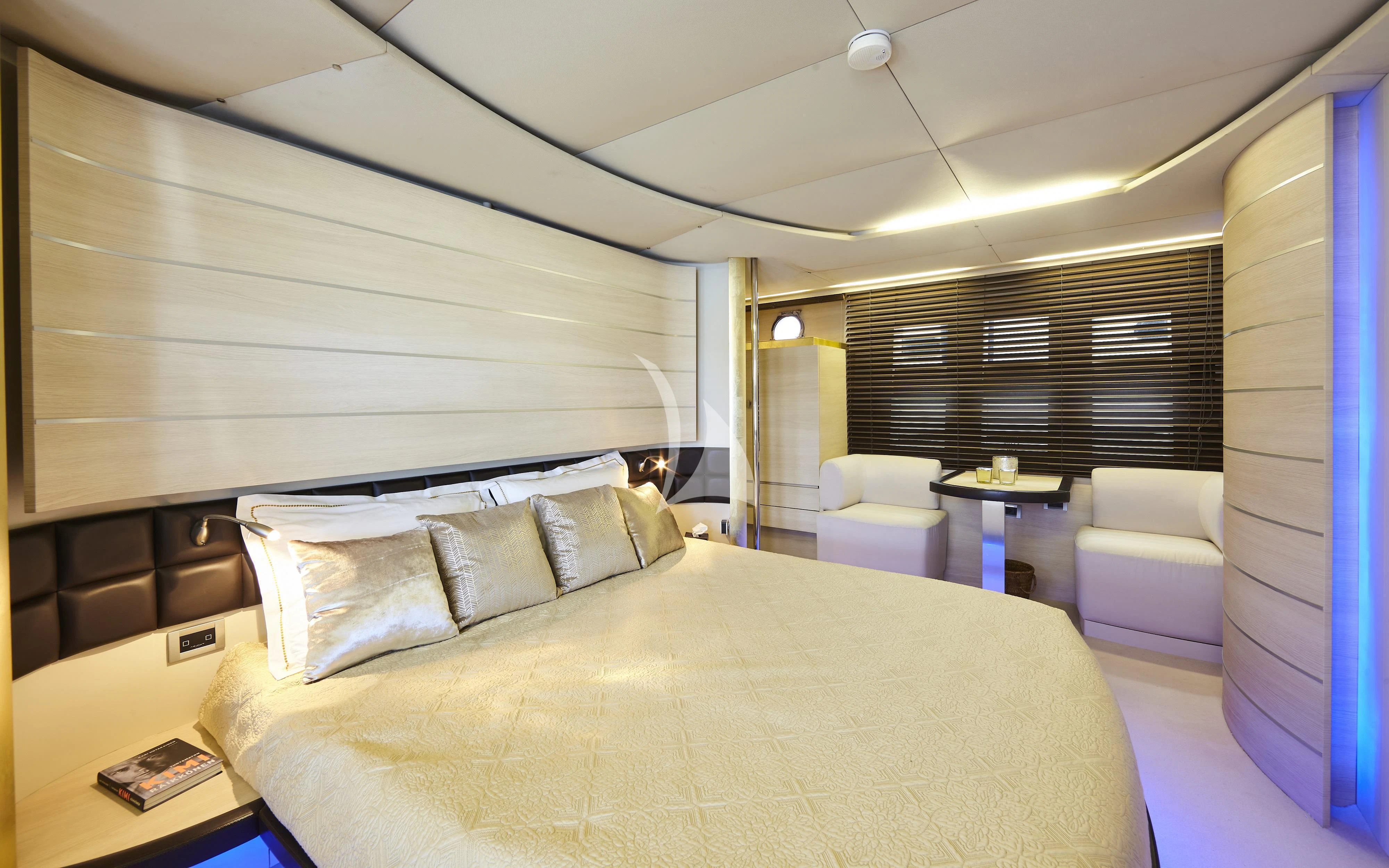 a bedroom with a bed and a desk aboard NAMI Yacht for Sale
