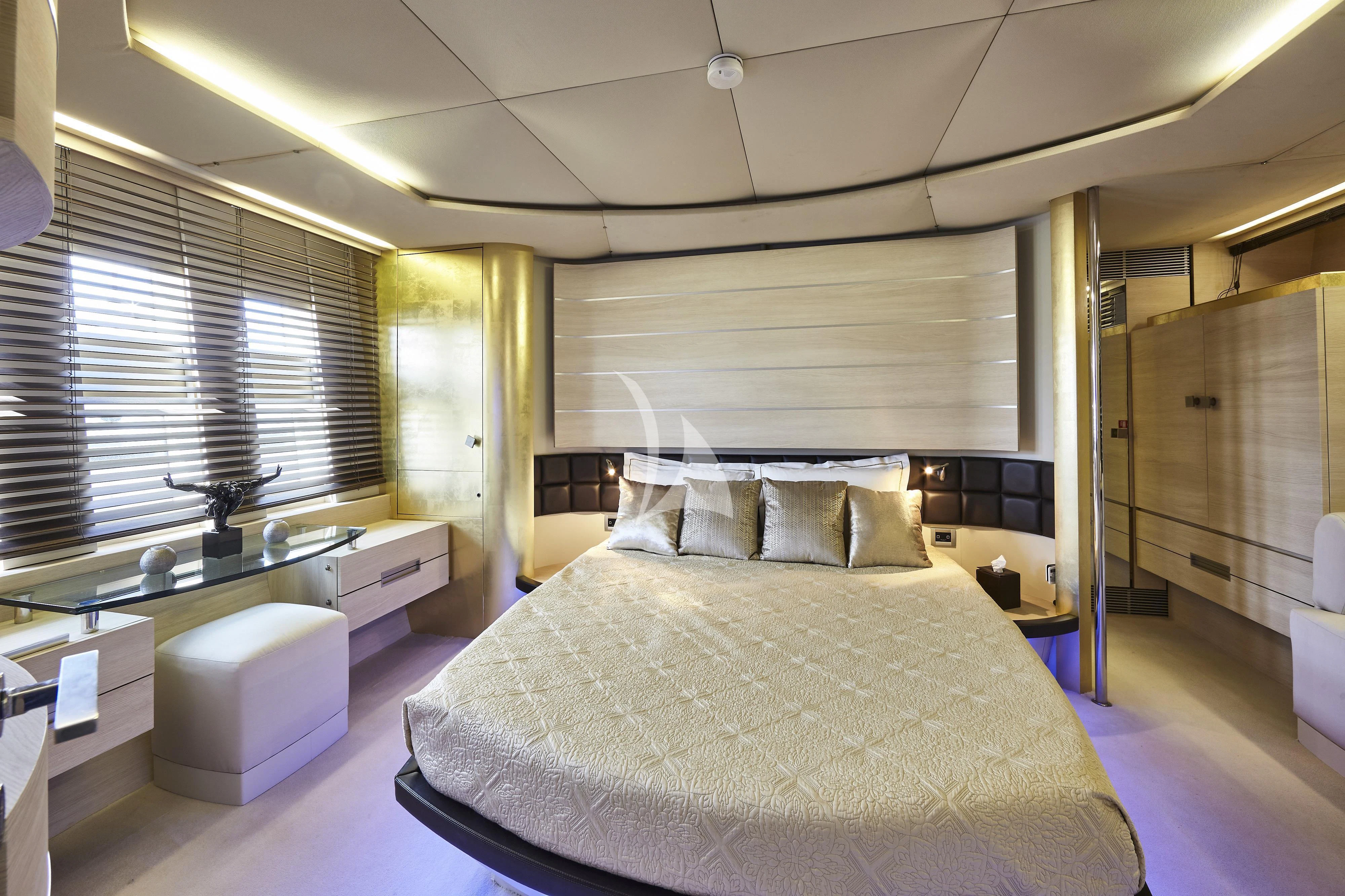 a bedroom with a large bed aboard NAMI Yacht for Sale
