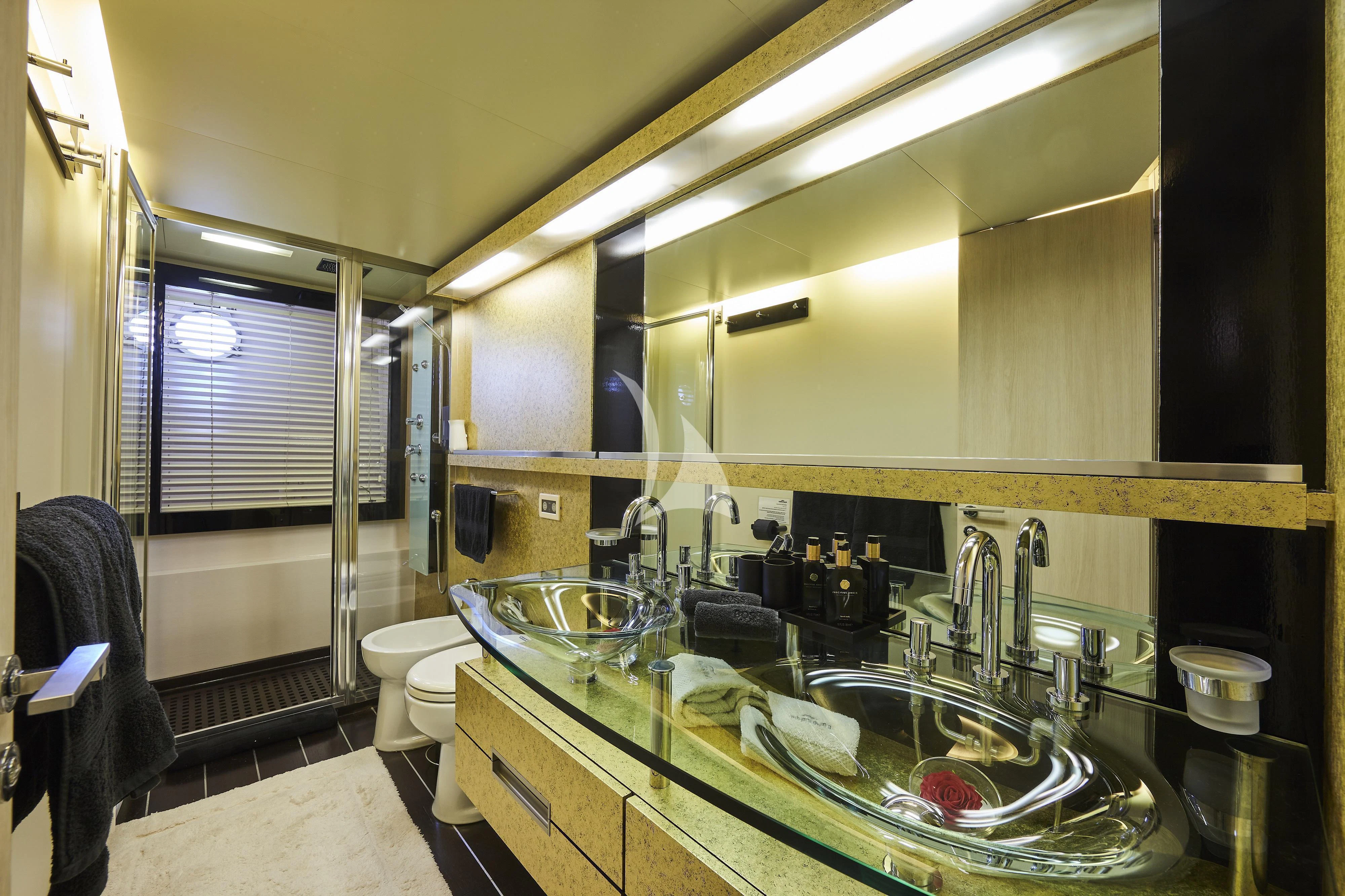 a bathroom with a sink and a mirror aboard NAMI Yacht for Sale