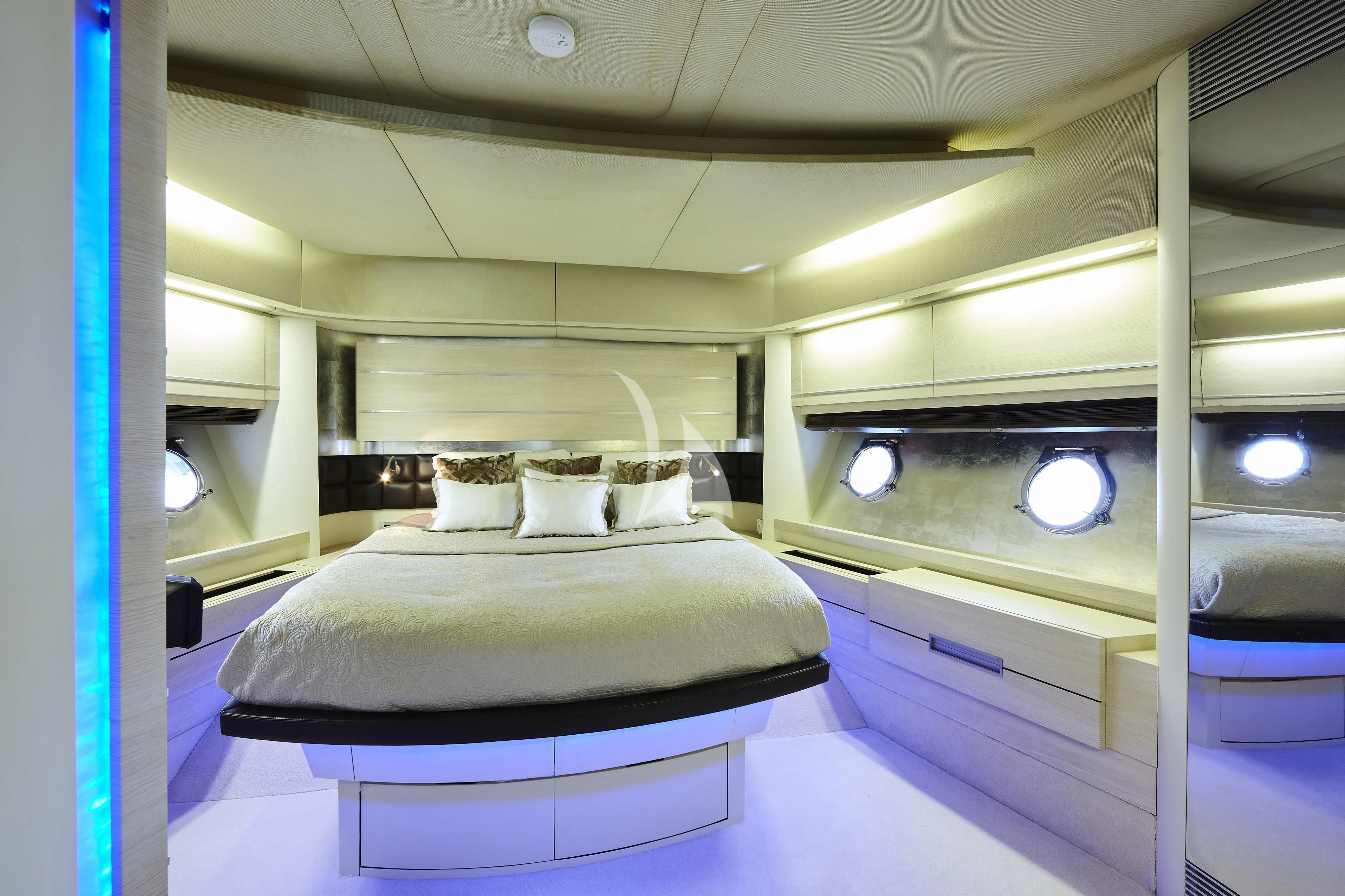 a room with a bed and a mirror aboard NAMI Yacht for Sale