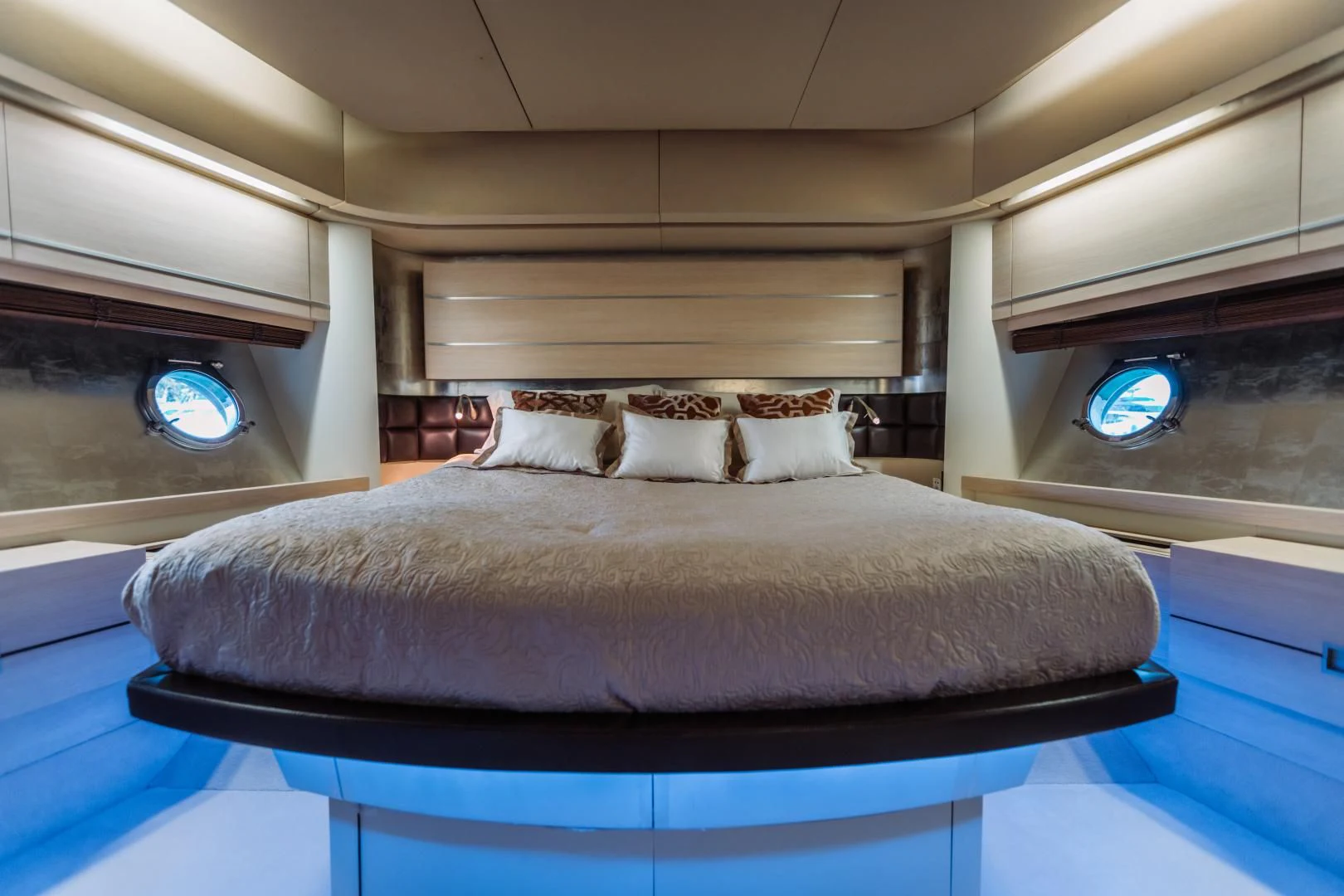 a bed with a blue sheet aboard NAMI Yacht for Sale