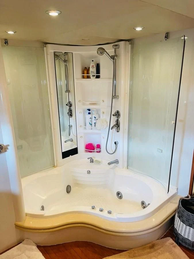 a bathroom with a large tub aboard LADY ESTHER Yacht for Sale