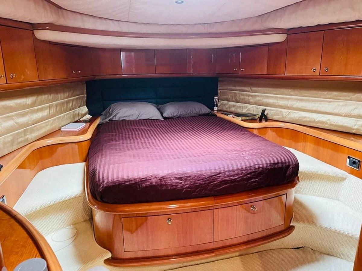 a bed in a room aboard LADY ESTHER Yacht for Sale