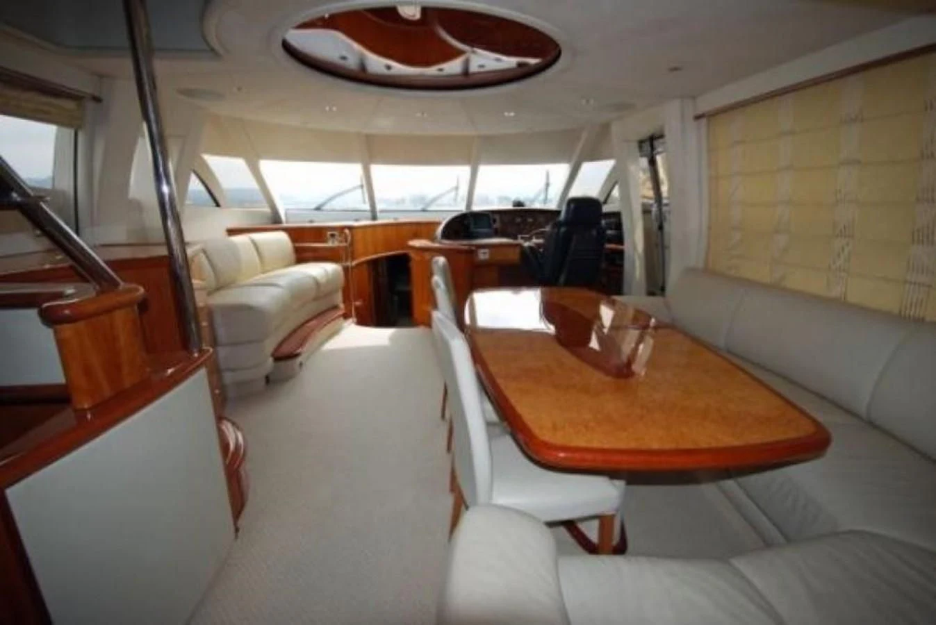a room with a table and chairs aboard LADY ESTHER Yacht for Sale