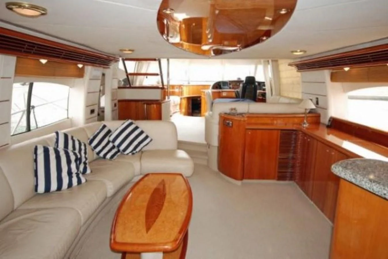 a large living room with a large open window aboard LADY ESTHER Yacht for Sale