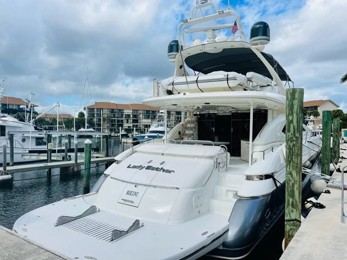 a boat docked at a pier aboard LADY ESTHER Yacht for Sale