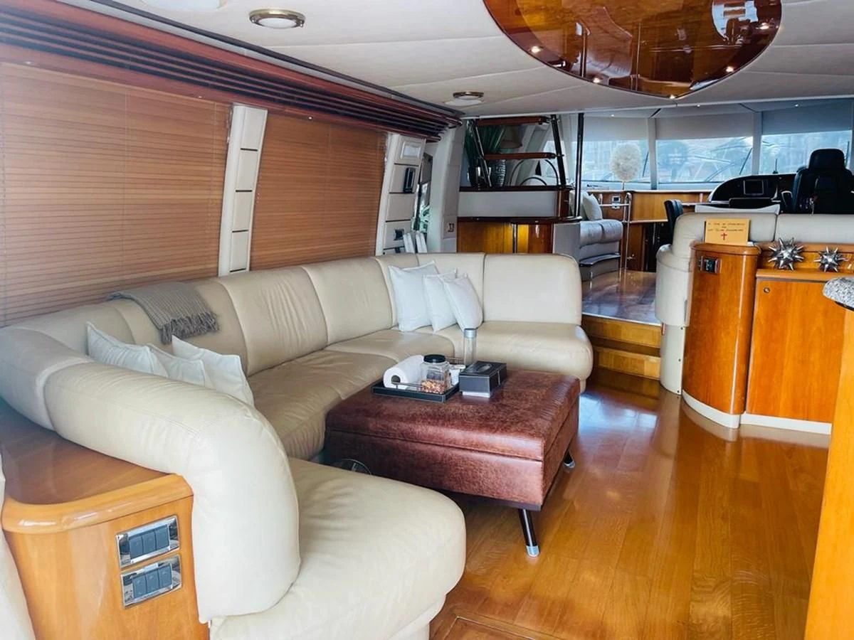 a living room with a couch and a table aboard LADY ESTHER Yacht for Sale