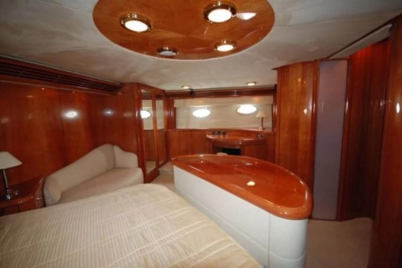 a room with a bed and a couch aboard LADY ESTHER Yacht for Sale
