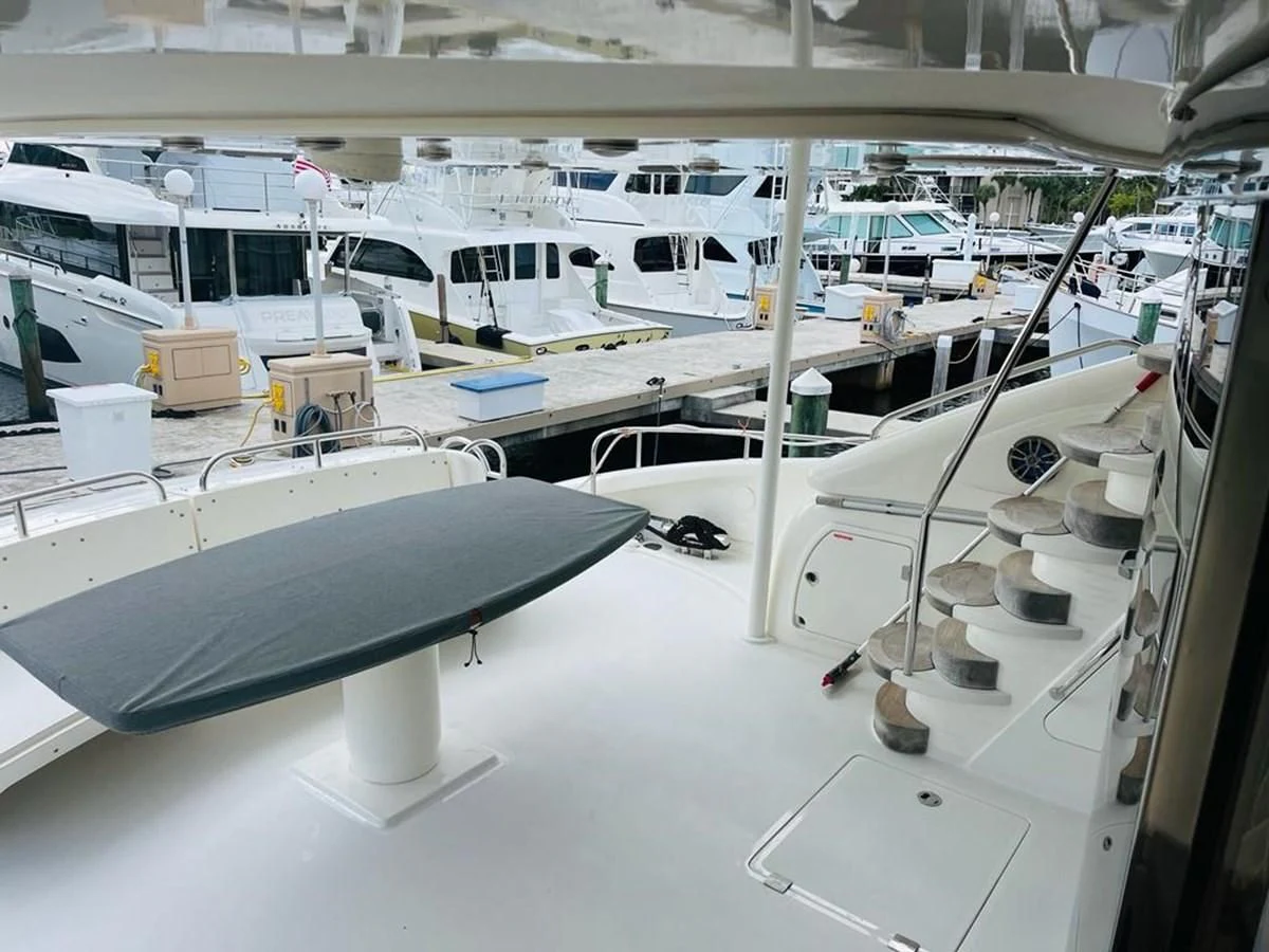 a room with a table and chairs aboard LADY ESTHER Yacht for Sale