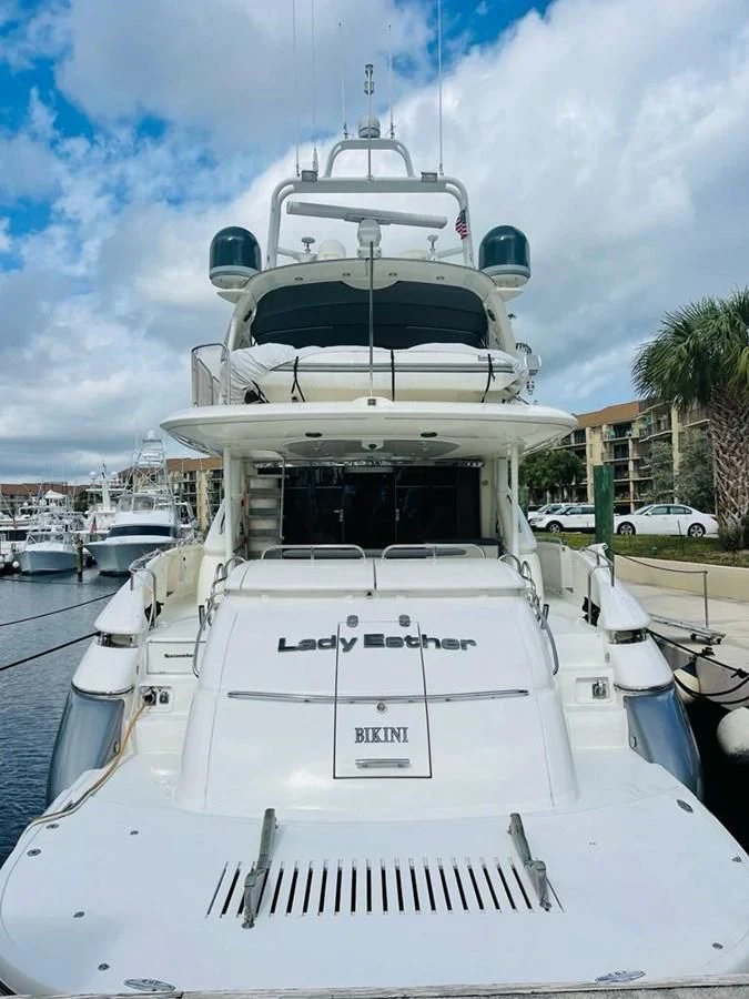 a white boat with a black and white stripe on it aboard LADY ESTHER Yacht for Sale