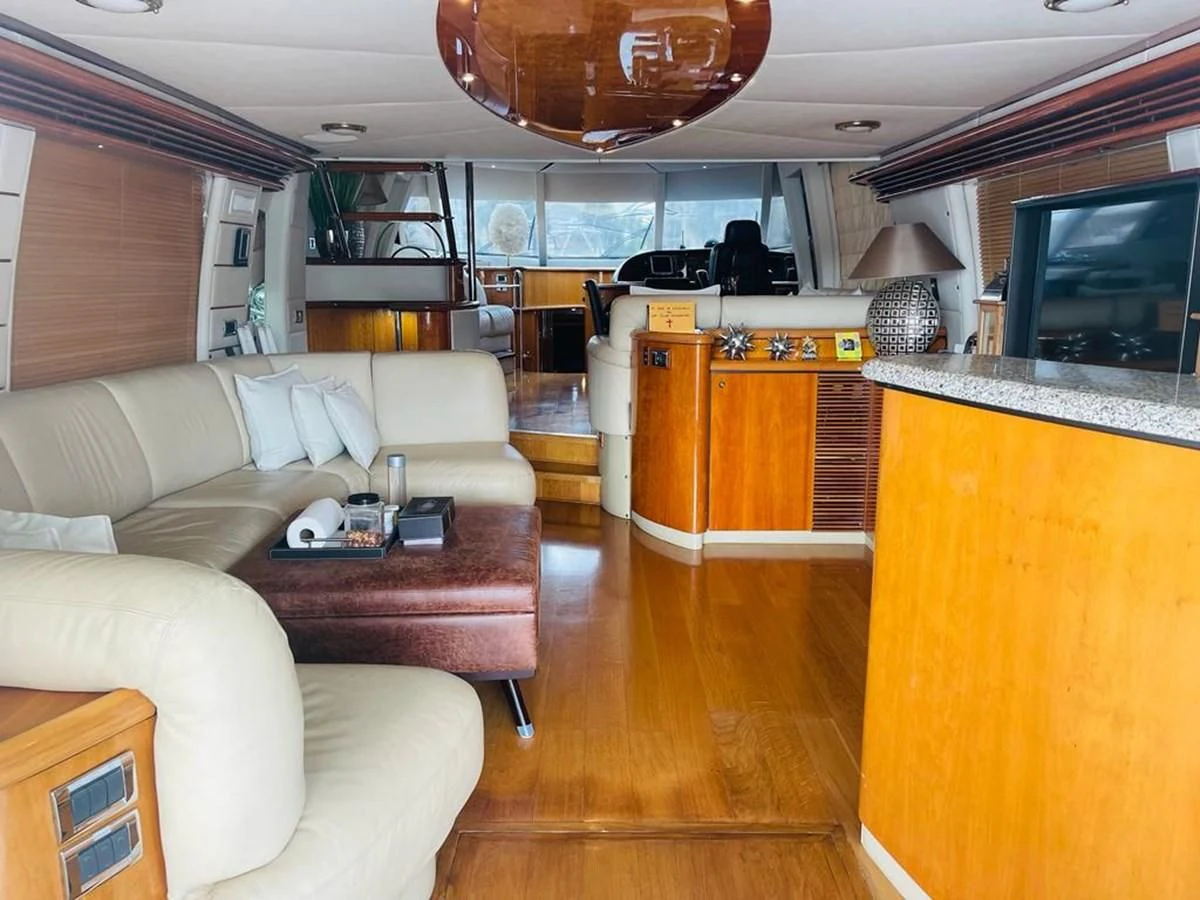 a living room with a large television aboard LADY ESTHER Yacht for Sale