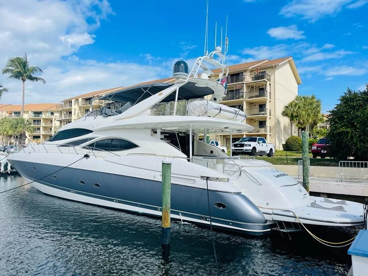 a boat docked at a pier aboard LADY ESTHER Yacht for Sale