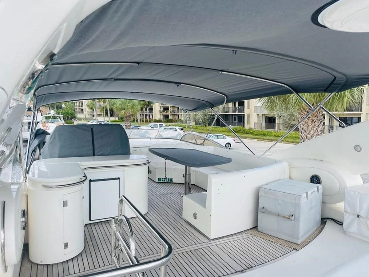 a white car with a grill aboard LADY ESTHER Yacht for Sale