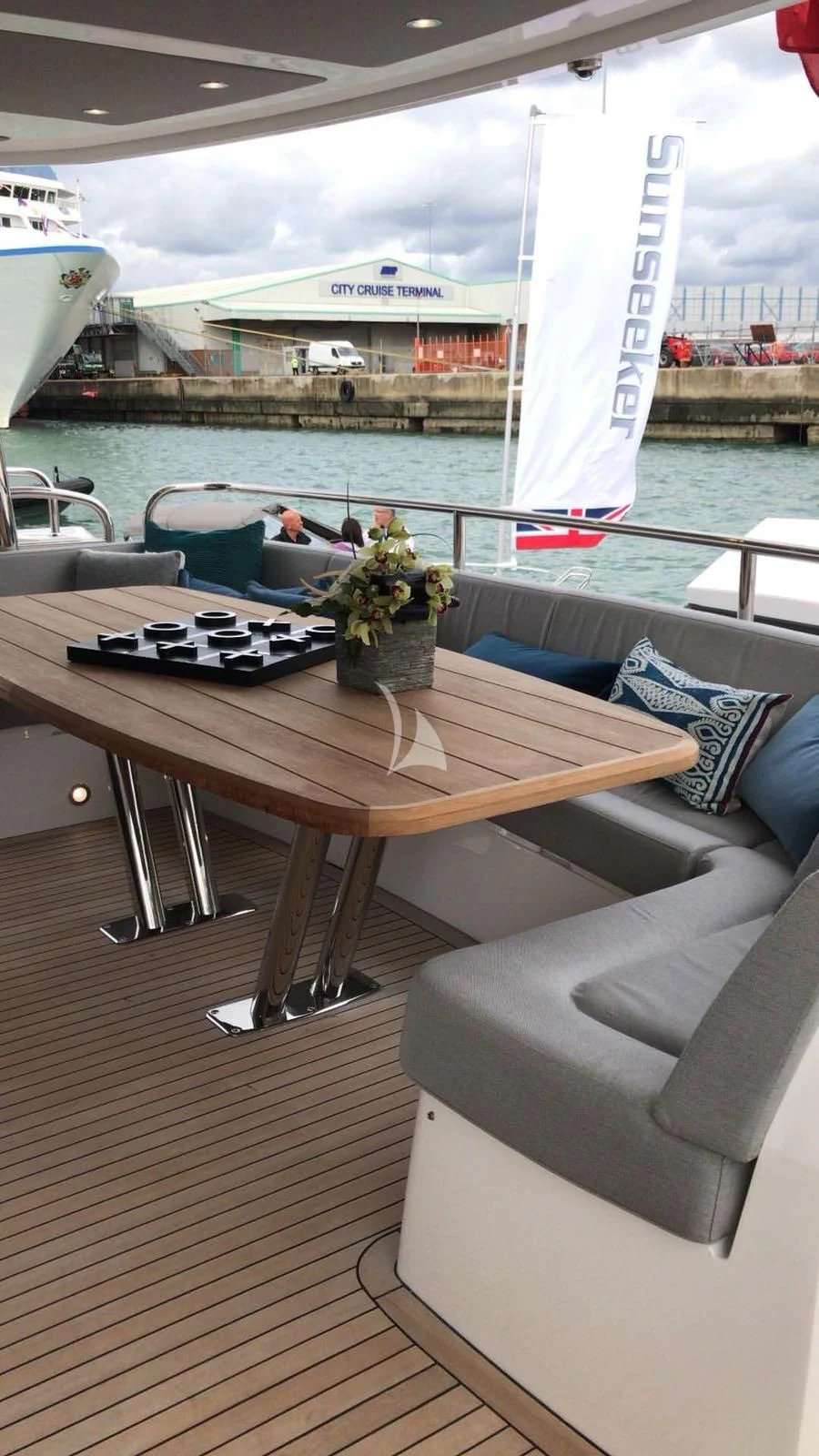a table with a flower vase on it aboard BLUE INFINITY Yacht for Sale