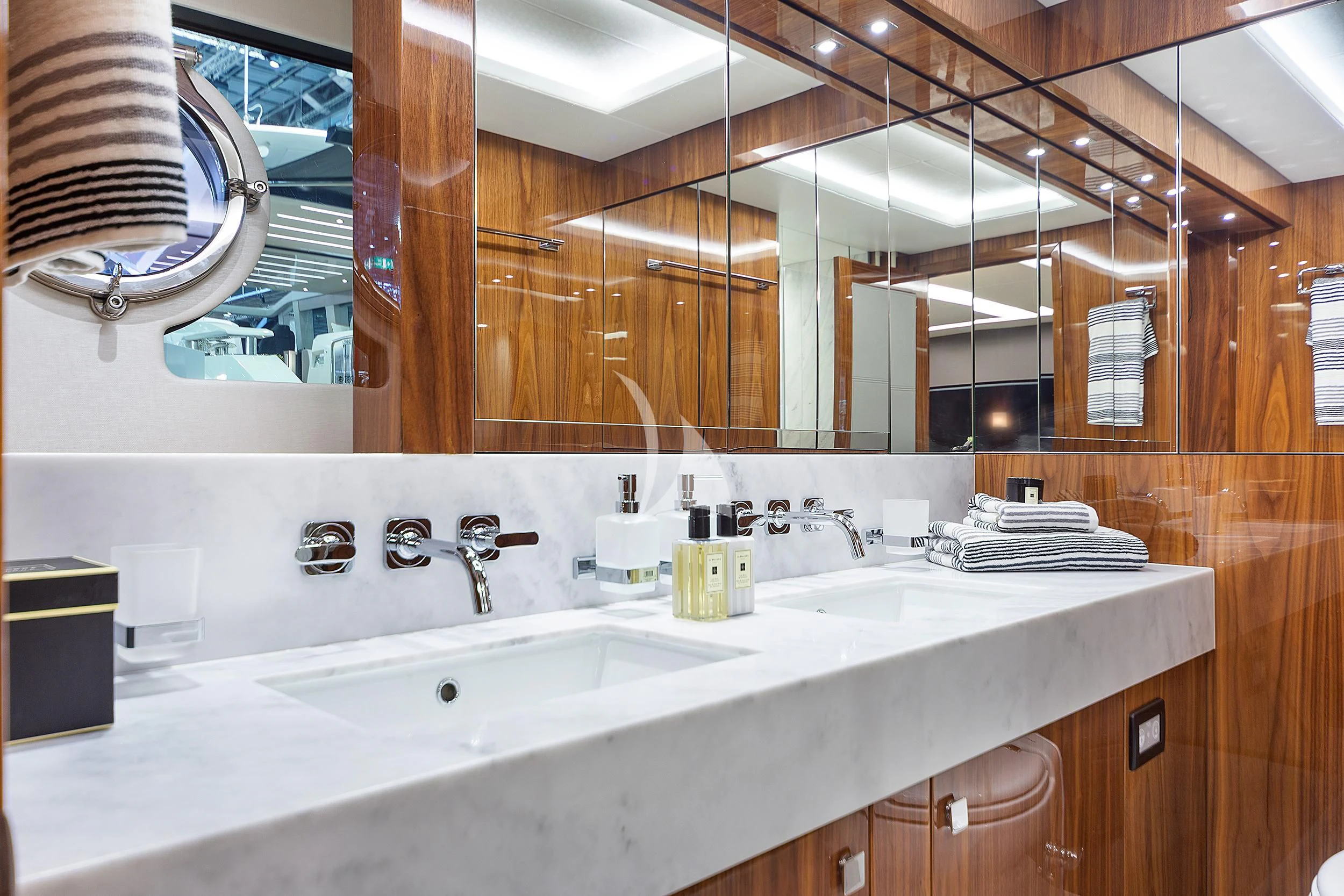 a bathroom with a large mirror aboard BLUE INFINITY Yacht for Sale