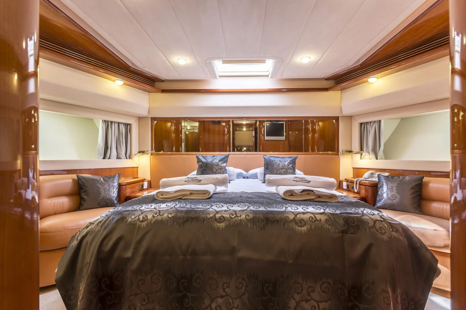 a large bed in a hotel room aboard MISS KATARIINA Yacht for Sale