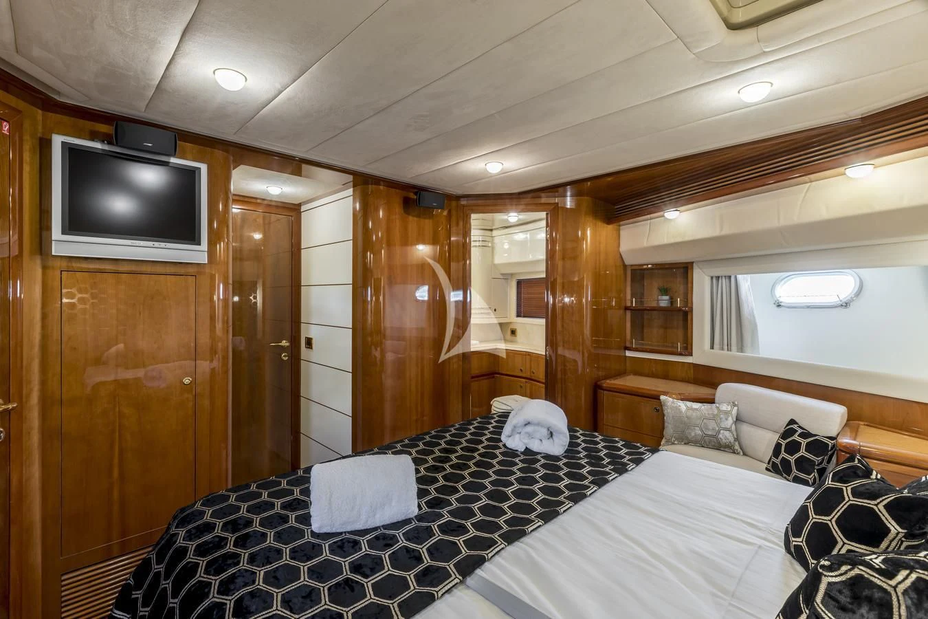 a bedroom with a bed and a television aboard MISS KATARIINA Yacht for Sale